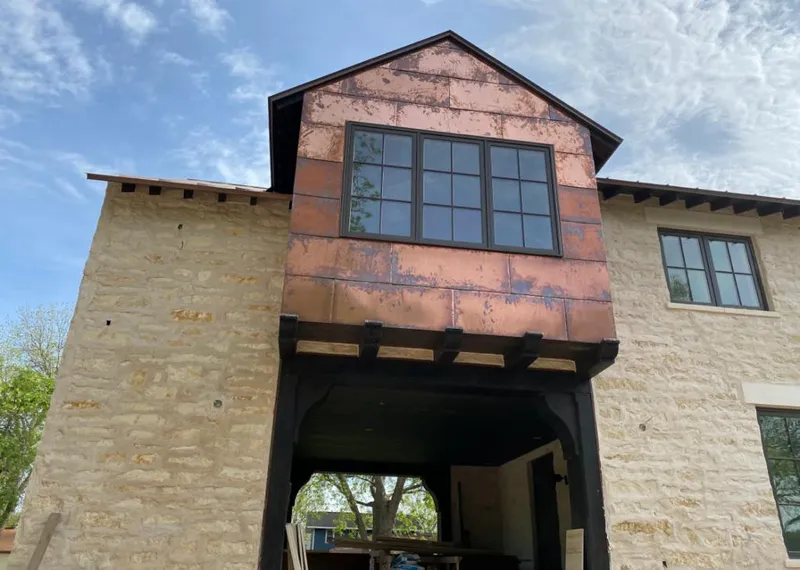 Copper metal panel facade on a stone building for Metal Roof Coating in North Elba