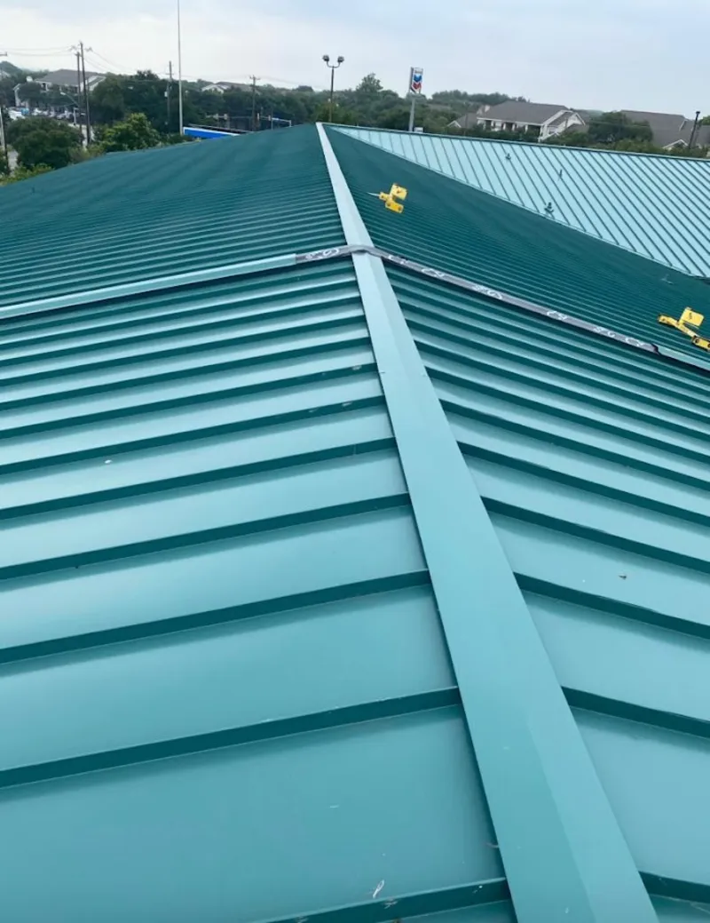 Green commercial metal roof ridge and valley for Metal Roof Repair in North Elba